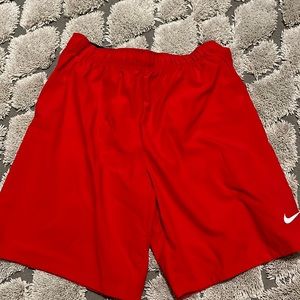 Red Nike nylon shorts